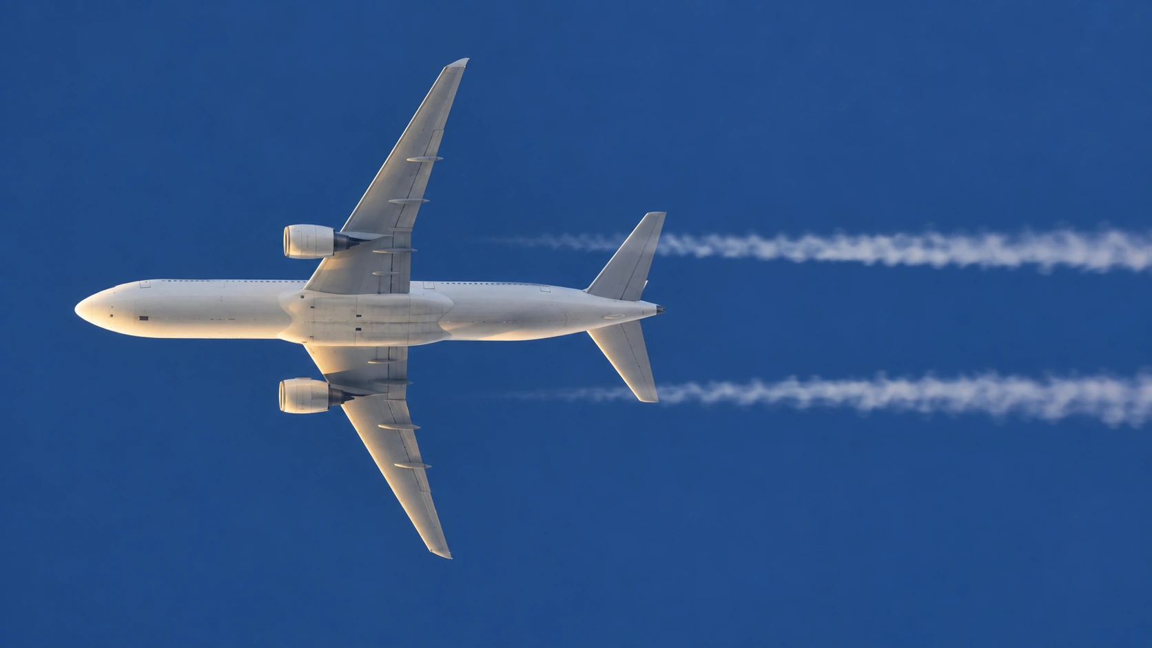 Editorial illustration: CORSIA addresses international aviation emissions; IATA is calling for a stronger framework.