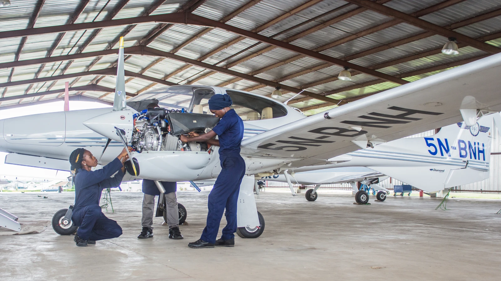 Archive photograph of aircraft engineers working on an exposed engine at International Aviation College in Kwara State, Nigeria, in2016.