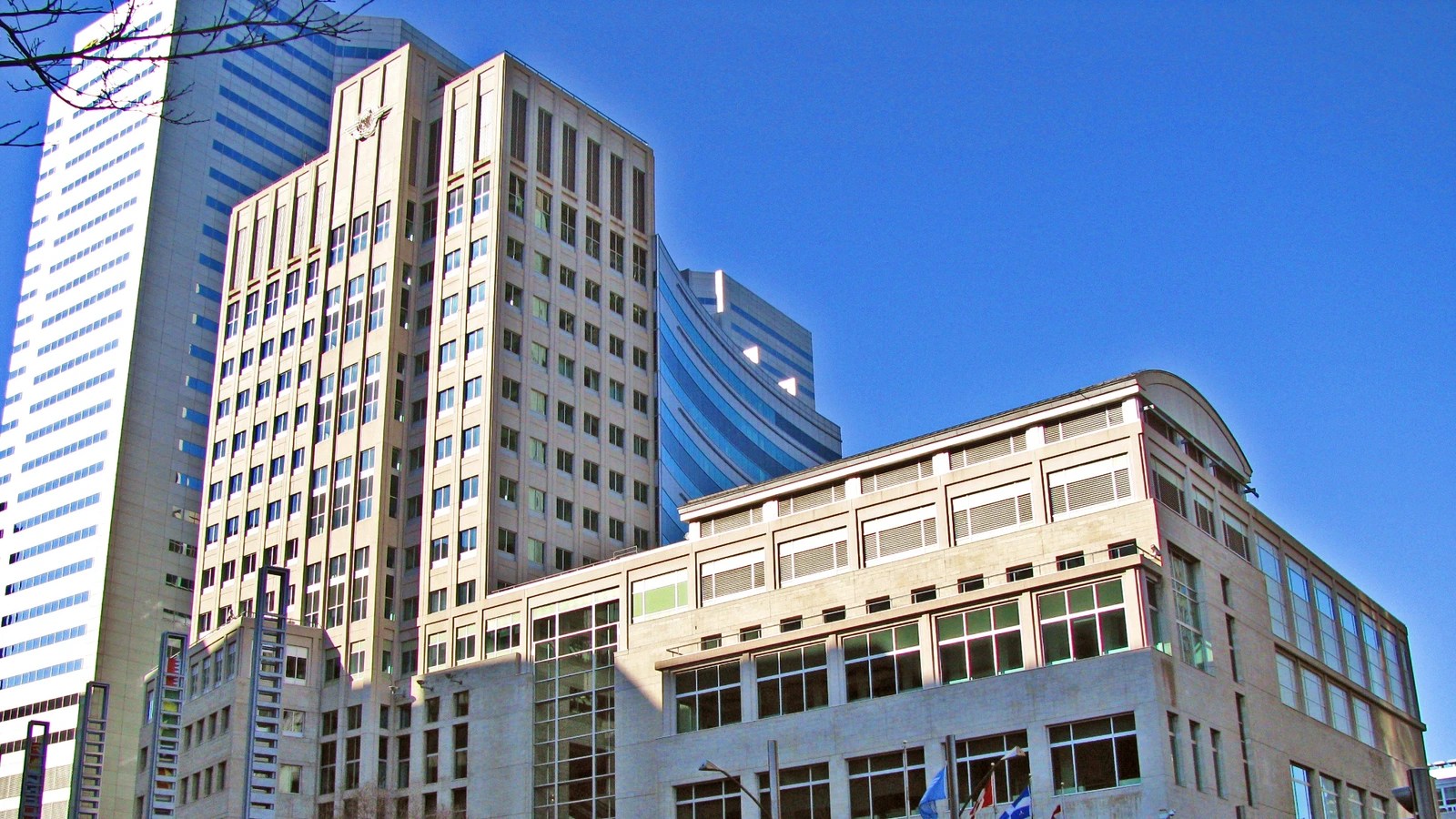 Archive architectural detail of ICAO headquarters in Montreal in April 2008, showing its stone tower and adjoining curved-roof facade.