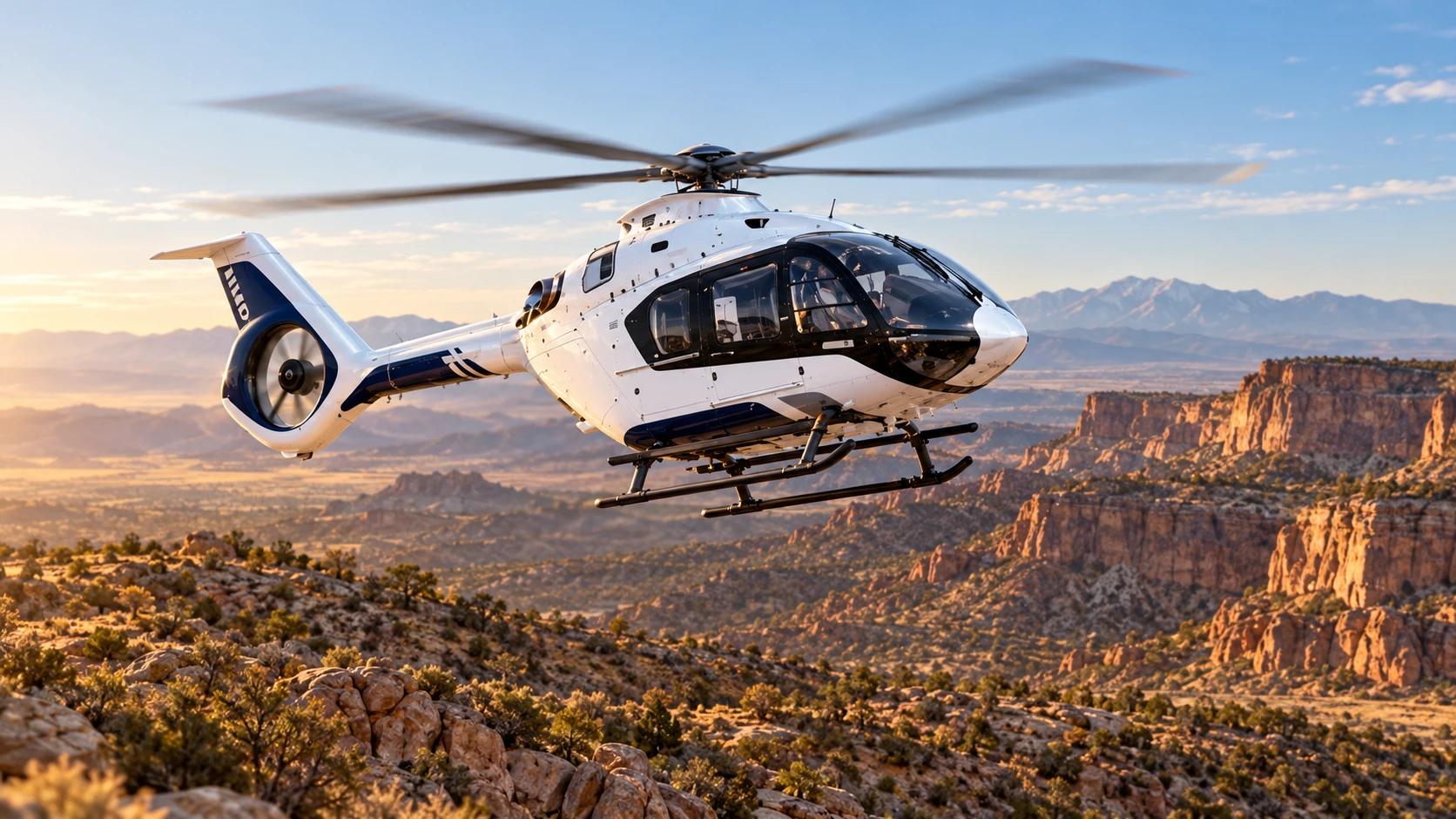 Airbus H140 helicopter hovering over a high-desert landscape, illustrated.